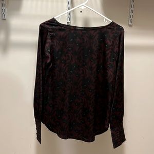 Gorgeous, silky, floral boat neck, long sleeve blouse with fitted button cuffs